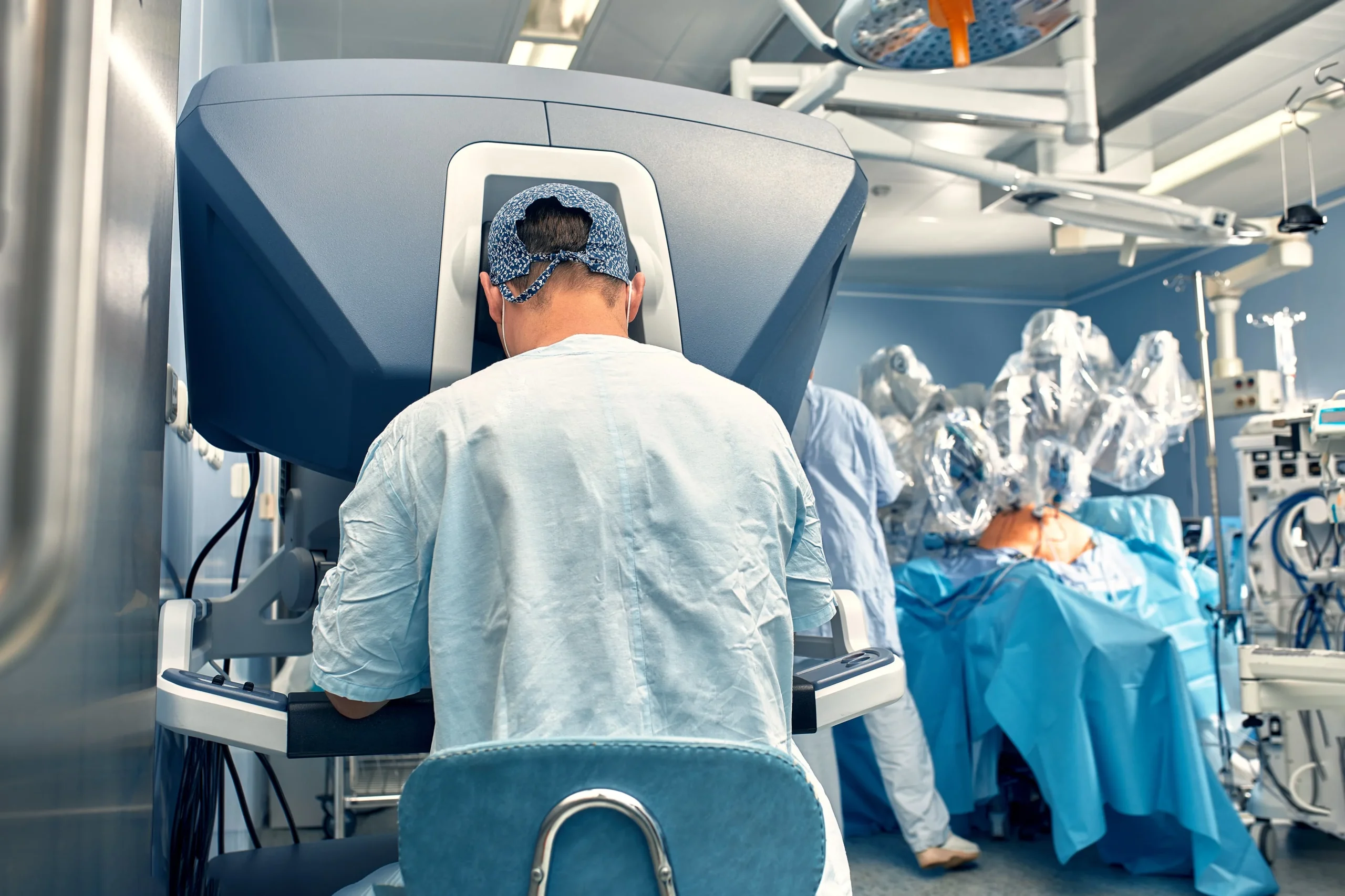 carrying out operation using robot robot surgeon with manipulators modern operating room su min scaled
